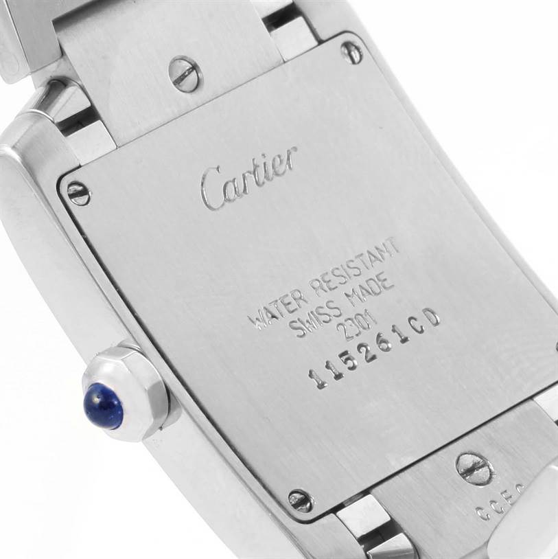 This image shows the back case of a Cartier Tank Française watch, highlighting the brand engraving and serial number.