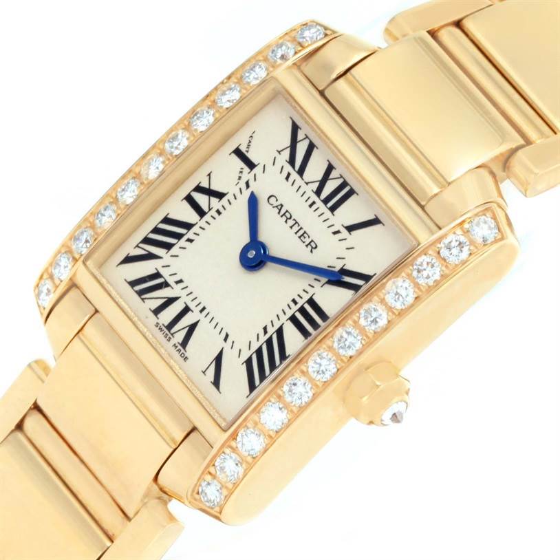 The image shows a Cartier Tank Francaise WE1001R8 Women's Yellow Gold Silver Dial WE1001R8 Women's Yellow Gold Silver Dial watch, focusing on the face, dial, and part of the bracelet, viewed at an angle.