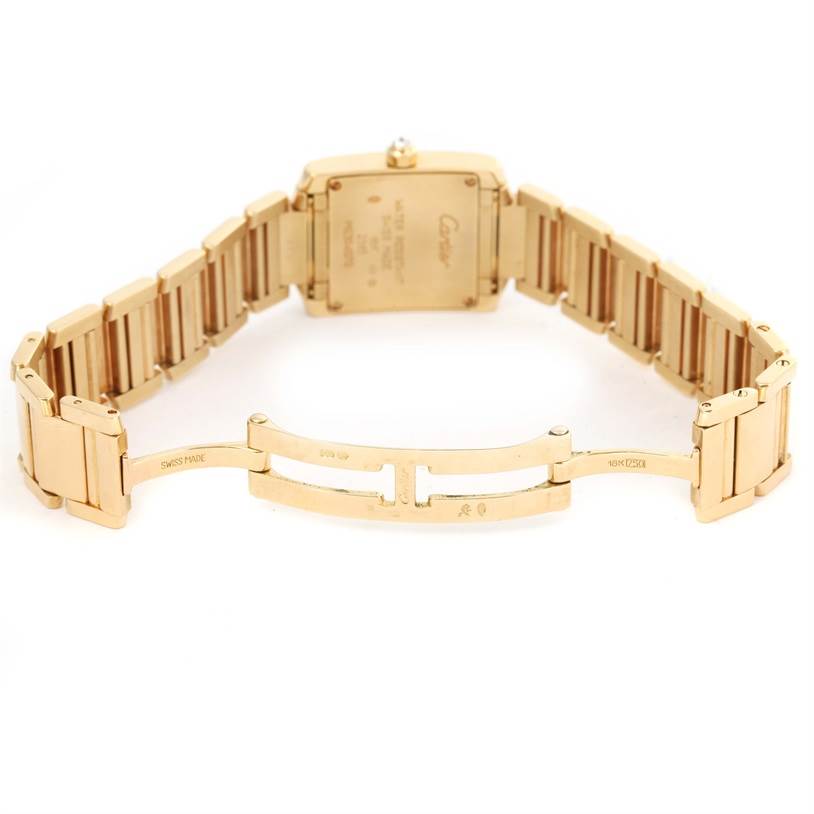 This image shows the back of the Tank Francaise watch by Cartier, highlighting the open bracelet and clasp.