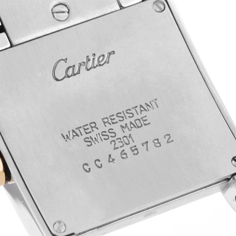 This image shows the back case of a Cartier Tank Francaise W2TA0003 Women's Steel and Gold (two tone) Silver Dial W2TA0003 Women's Steel and Gold (two tone) Silver Dial watch, highlighting the brand engraving and serial number.