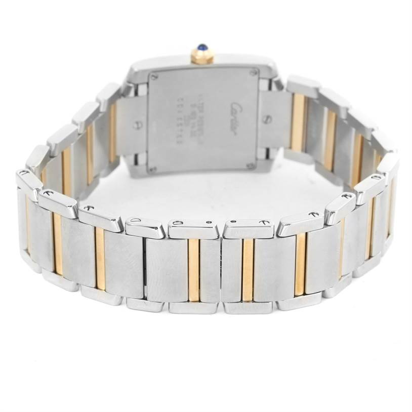 The image shows the backside and bracelet of the Cartier Tank Française watch, highlighting its two-tone metal links and case back.