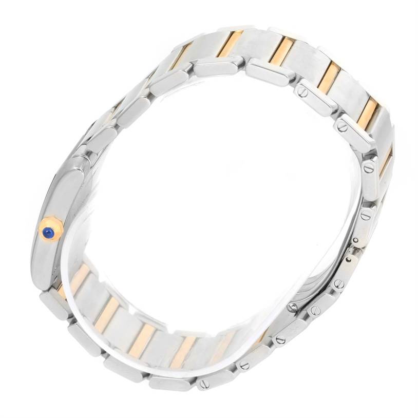 The image shows a side view of the bracelet and crown of a Cartier Tank Francaise W2TA0003 Women's Steel and Gold (two tone) Silver Dial W2TA0003 Women's Steel and Gold (two tone) Silver Dial watch, highlighting its two-tone design.