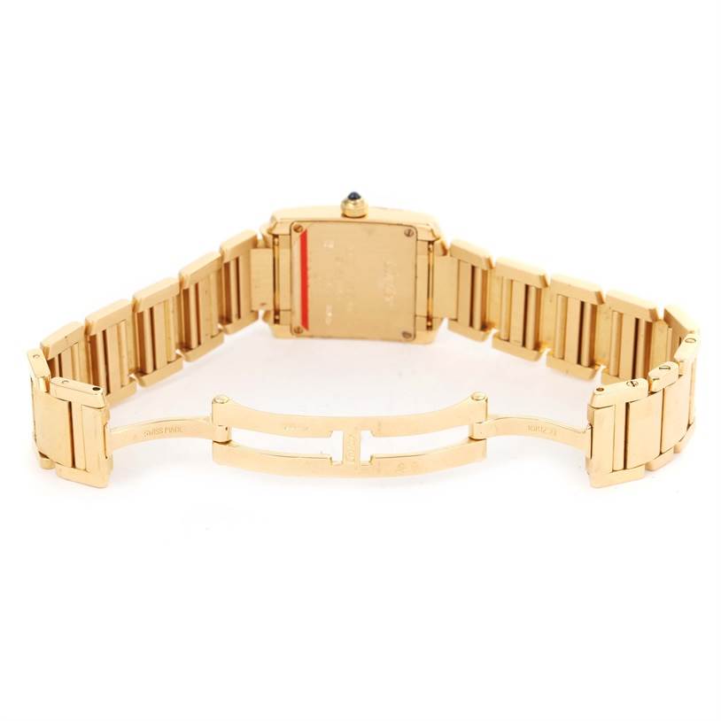 The image shows the backside and open clasp of a Cartier Tank Française watch.