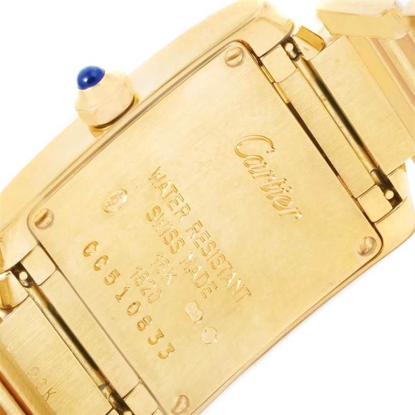 This image shows the back of a Tank Francaise wristwatch by Cartier, displaying the engraved details and crown.