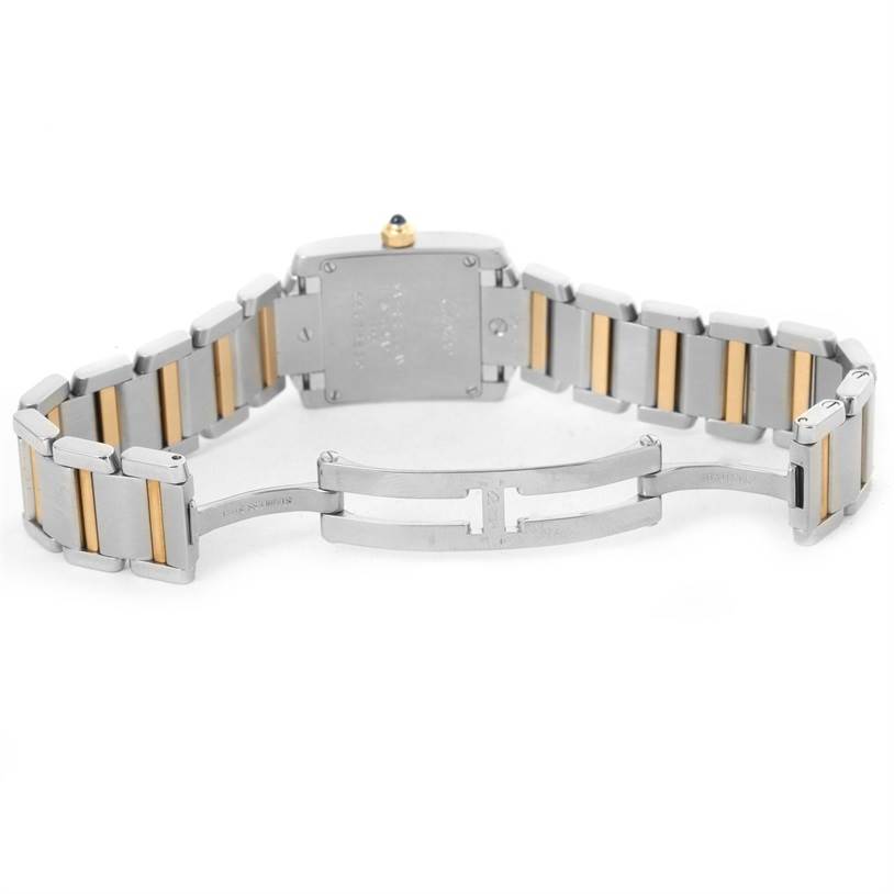 This image shows the back view of a Cartier Tank Française watch, highlighting the metal and gold-toned bracelet and clasp mechanism.
