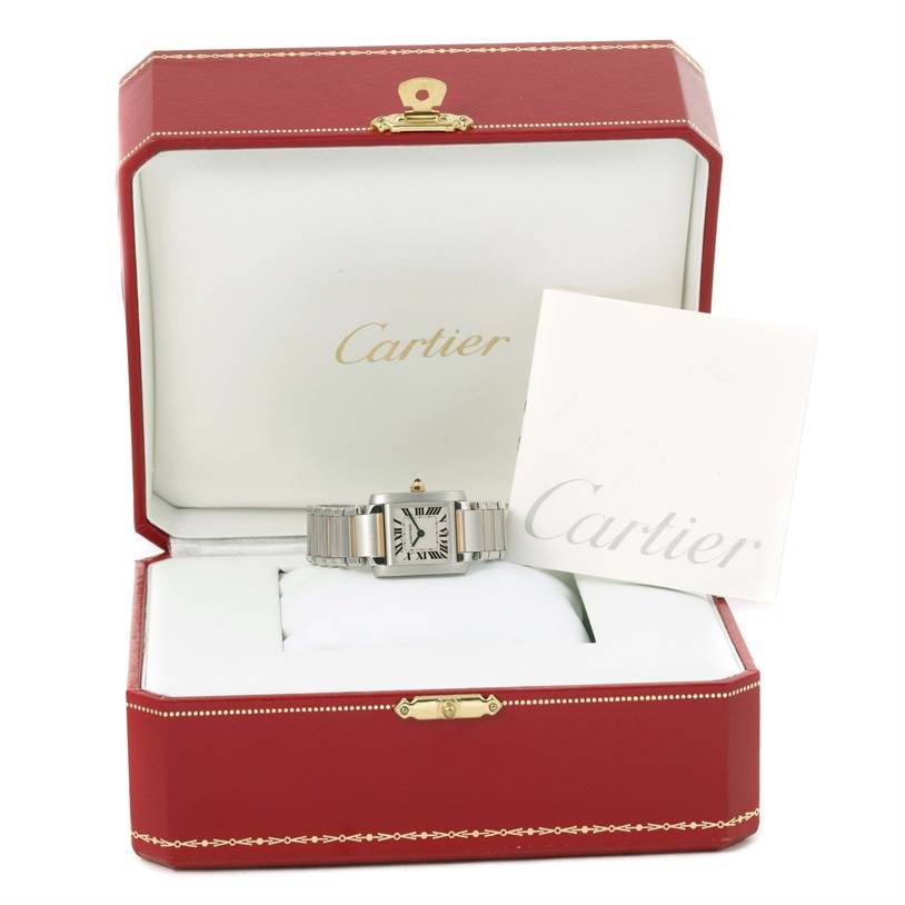 The Cartier Tank Française watch is displayed in an open red Cartier box, with the watch's face and bracelet visible.