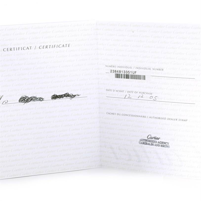 This image shows the open warranty certificate for a Cartier Tank Francaise W51007Q4 Women's Steel and Gold (two tone) Silver Dial W51007Q4 Women's Steel and Gold (two tone) Silver Dial watch, displaying purchase details and dealer stamp.