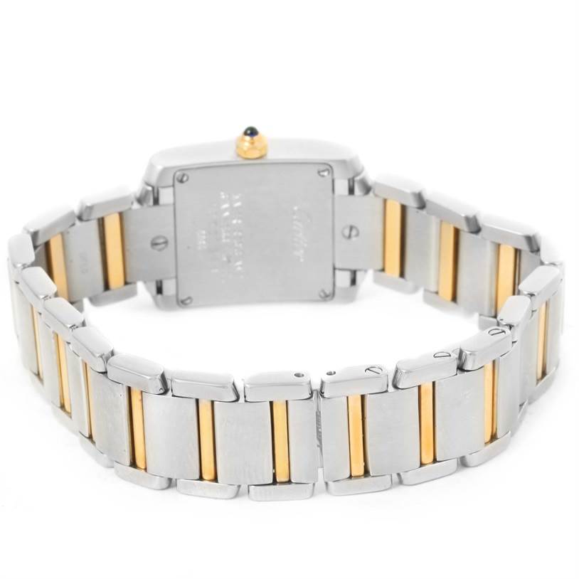 The image shows the back view of a Cartier Tank Française watch, highlighting the bracelet and case back.