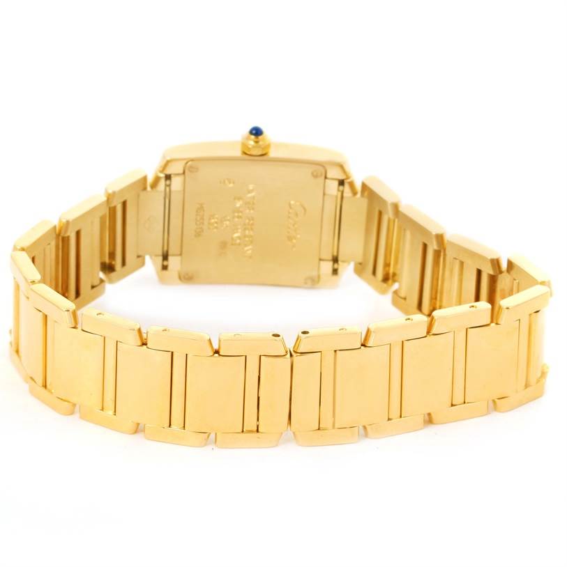 The image shows the back and part of the bracelet of a Tank Francaise model by Cartier.