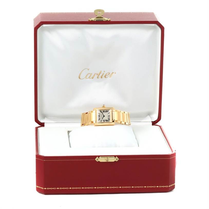 The image shows a Cartier Tank Française watch displayed in an open red Cartier box.