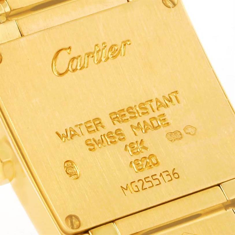 The image shows the back case of a Cartier Tank Francaise W50002N2 Women's Yellow Gold Silver Dial W50002N2 Women's Yellow Gold Silver Dial watch, displaying engravings and markings.