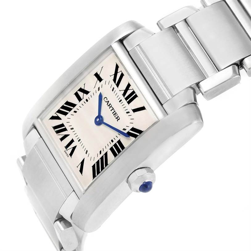 The angled view of the Cartier Tank Française watch shows its face, Roman numerals, blue hands, crown, and part of the bracelet.