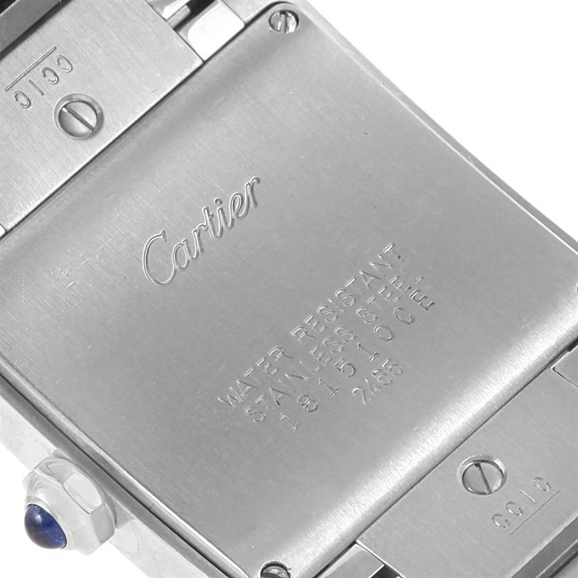 This image shows the back case of a Cartier Tank Francaise W51011Q3 Women's Stainless Steel Silver Dial W51011Q3 Women's Stainless Steel Silver Dial watch with visible engravings and part of the crown.