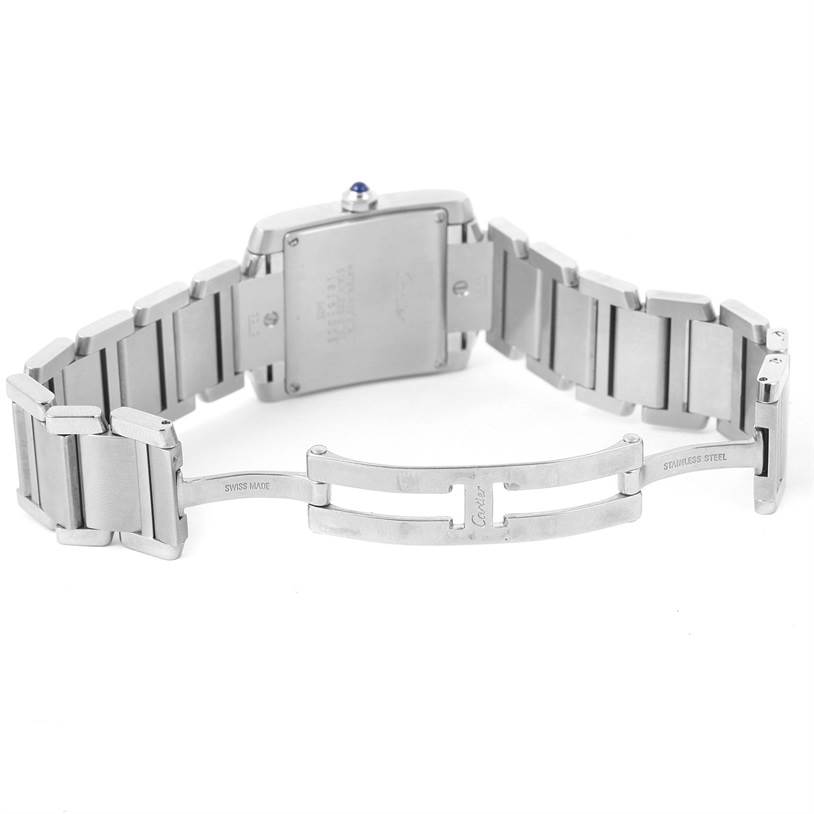 The image shows the back view of a Cartier Tank Francaise W51011Q3 Women's Stainless Steel Silver Dial W51011Q3 Women's Stainless Steel Silver Dial watch with an open stainless steel bracelet and clasp.