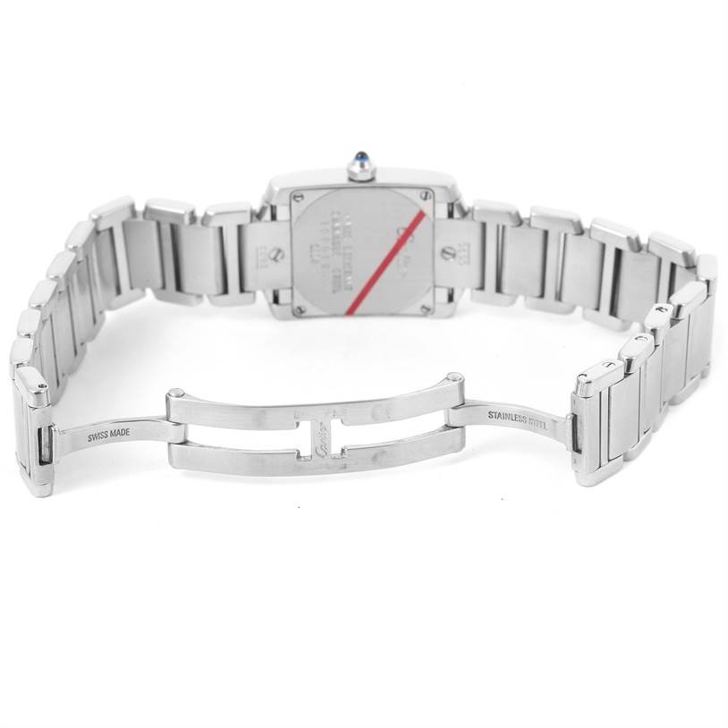 The image shows the back view of a Cartier Tank Française watch, highlighting its stainless steel bracelet and clasp.