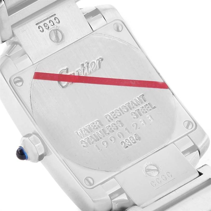 The image shows the backside of a Cartier Tank Francaise W51008Q3 Women's Stainless Steel Silver Dial W51008Q3 Women's Stainless Steel Silver Dial watch, highlighting the case back and part of the bracelet clasp.