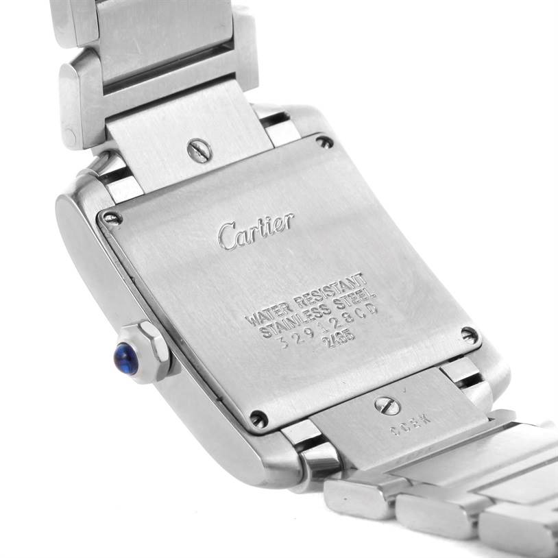 The image shows the back casing and part of the bracelet of a Cartier Tank Française watch.