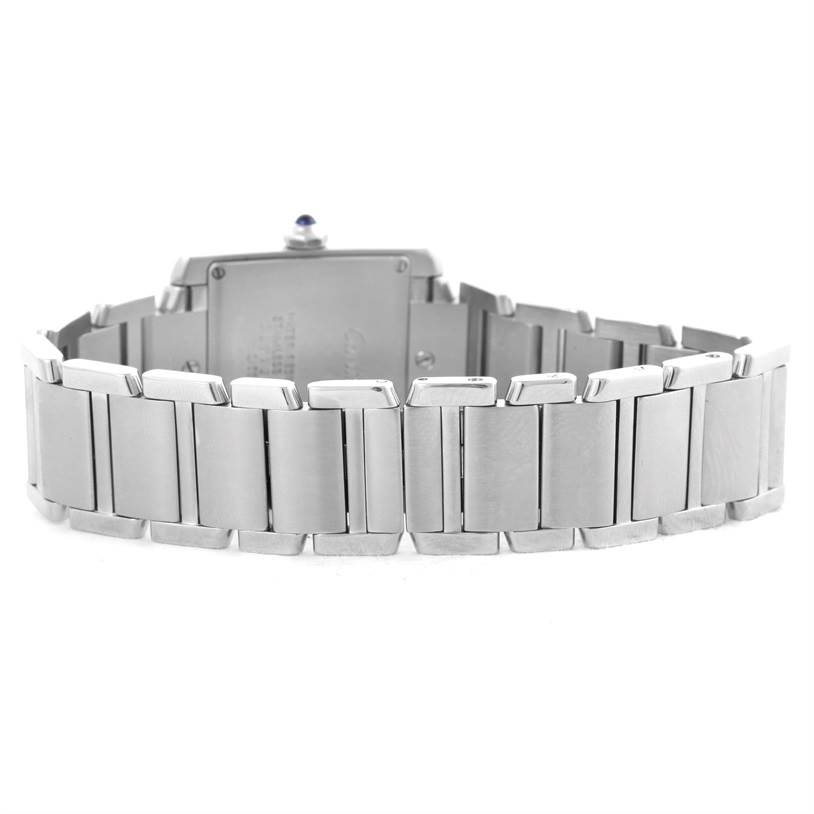 The image shows the back view of a Cartier Tank Francaise W51011Q3 Women's Stainless Steel White Dial W51011Q3 Women's Stainless Steel White Dial watch, highlighting its metal bracelet and case back.