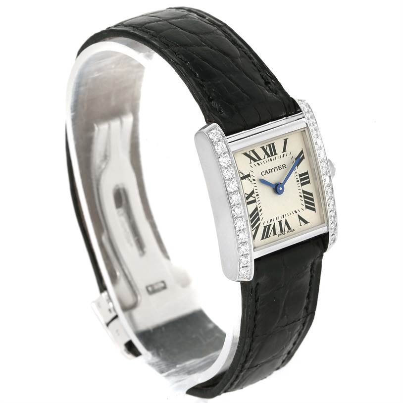 The Cartier Tank Francaise WE100231 Women's White Gold Silver Dial WE100231 Women's White Gold Silver Dial watch is shown at an angle highlighting the rectangular face, diamond accents, and black leather strap.