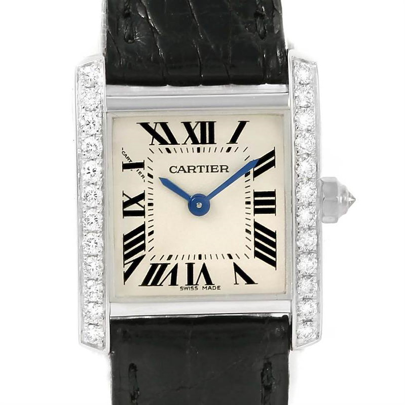 The image shows a close-up of a Cartier Tank Francaise watch face with a diamond-studded bezel and black leather strap.