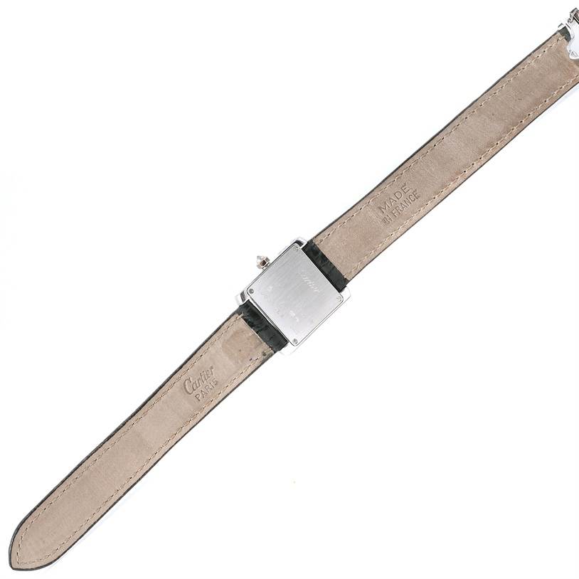 The image shows the back view of a Cartier Tank Française watch, displaying its case back and leather strap.