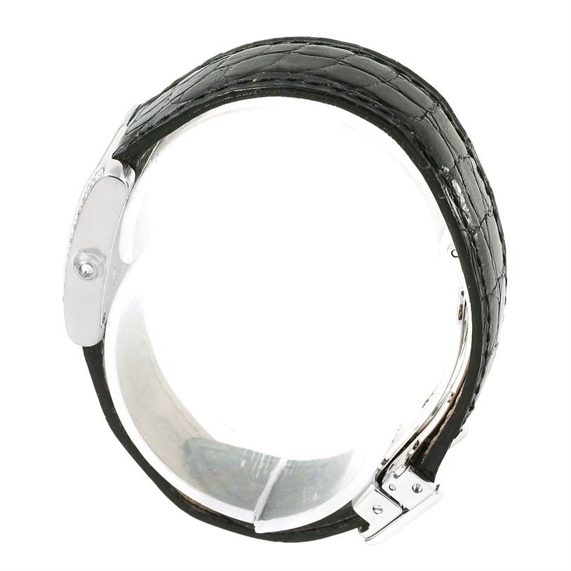 The image shows the Cartier Tank Francaise WE100231 Women's White Gold Silver Dial WE100231 Women's White Gold Silver Dial watch from a top angle, highlighting the black leather strap and part of the metal clasp.