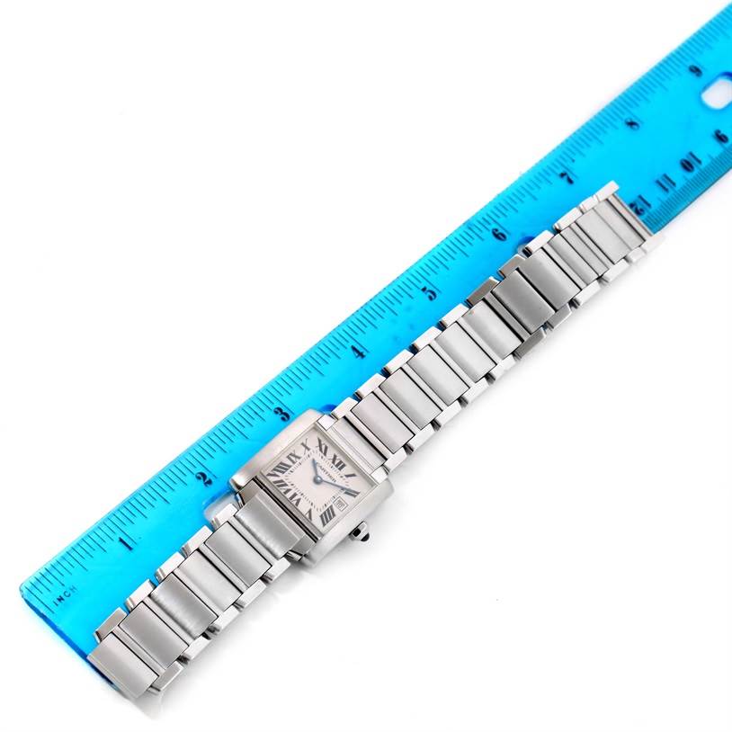 The Cartier Tank Francaise W51011Q3 Women's Stainless Steel White Dial W51011Q3 Women's Stainless Steel White Dial watch is shown from a top-down angle, displaying the face, bracelet, and a ruler beside it for size reference.