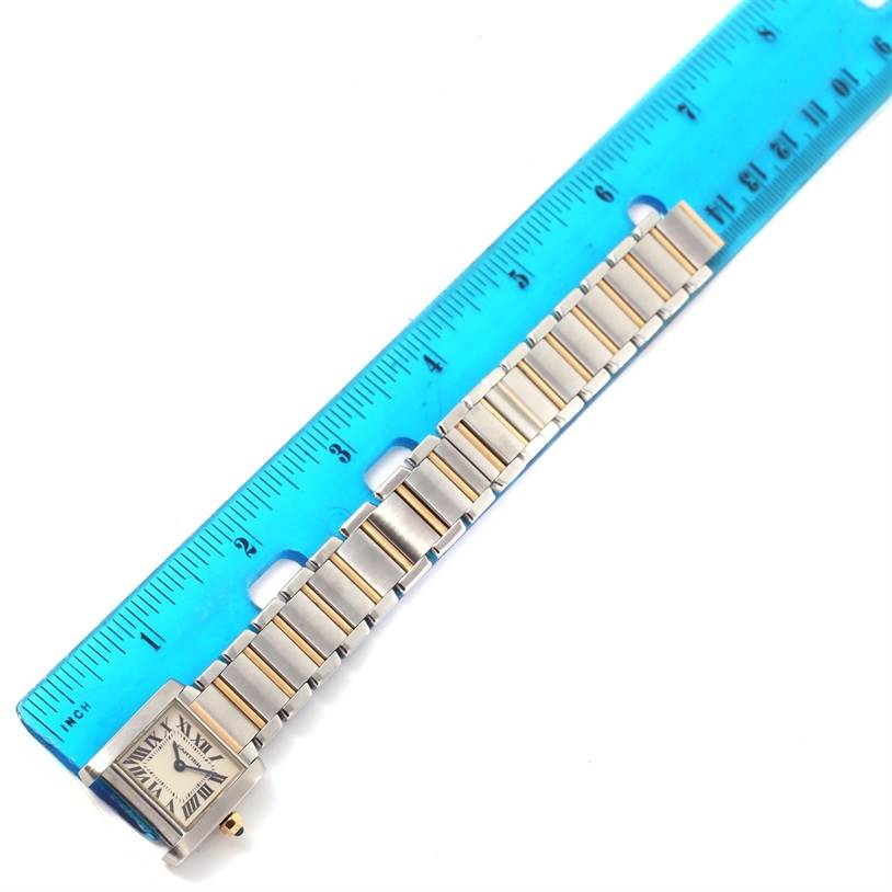 The Cartier Tank Francaise W51007Q4 Women's Steel and Gold (two tone) Silver Dial W51007Q4 Women's Steel and Gold (two tone) Silver Dial watch is shown from a top view, with the band placed alongside a ruler for measurement.