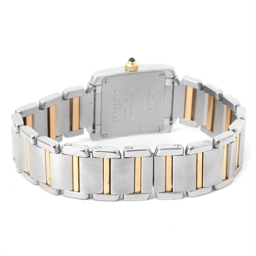 This image shows the back of a Cartier Tank Française watch, highlighting its two-tone metal bracelet and case back.