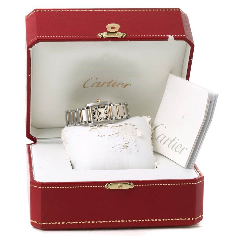 The Cartier Tank Francaise W51007Q4 Women's Steel and Gold (two tone) Silver Dial W51007Q4 Women's Steel and Gold (two tone) Silver Dial watch is displayed inside its red case, accompanied by a booklet.