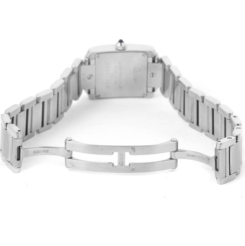 The image shows the back view of the Cartier Tank Française watch, displaying its stainless steel bracelet and deployment clasp.
