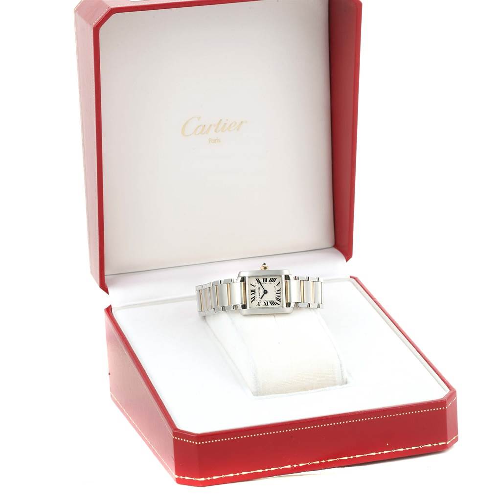 The Cartier Tank Française watch is displayed front-facing in its open red box.