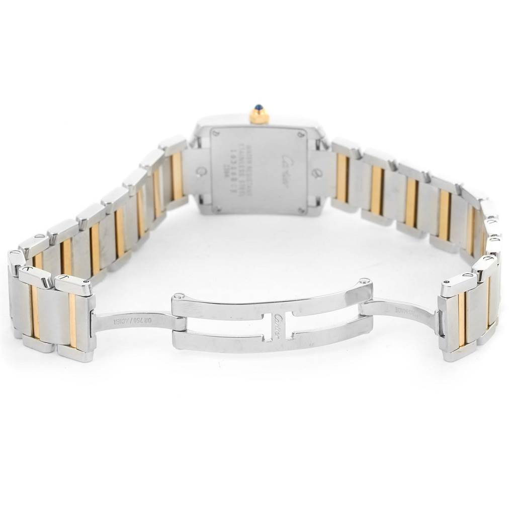 The image shows the back view of a Cartier Tank Francaise W51007Q4 Women's Steel and Gold (two tone) Silver Dial W51007Q4 Women's Steel and Gold (two tone) Silver Dial watch, highlighting the clasp and part of the metal bracelet.