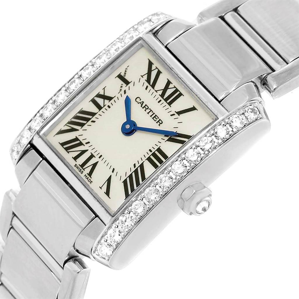 This image shows a close-up, angled view of the Cartier Tank Française watch, highlighting its face, crown, and band.