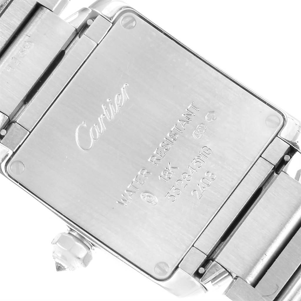 The image shows the back case of a Cartier Tank Francaise WE1002S3 Women's White Gold Silver Dial WE1002S3 Women's White Gold Silver Dial watch, highlighting its engravings and part of the bracelet.