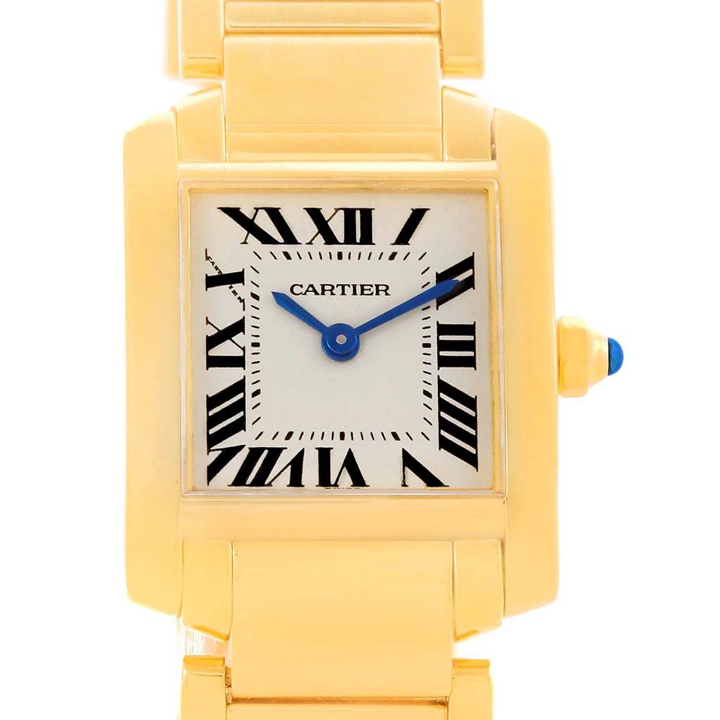 The image shows a close-up of the Cartier Tank Francaise W50002N2 Women's Yellow Gold Silver Dial W50002N2 Women's Yellow Gold Silver Dial watch, focusing on the face, hands, and part of the bracelet.