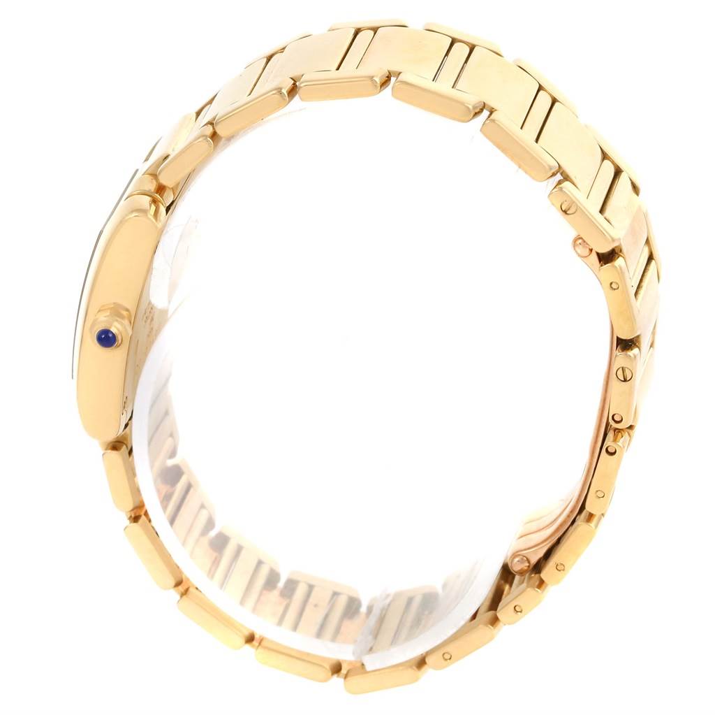 This image shows a side profile angle of the gold wristband and crown of a Cartier Tank Francaise W50002N2 Women's Yellow Gold Silver Dial W50002N2 Women's Yellow Gold Silver Dial watch.