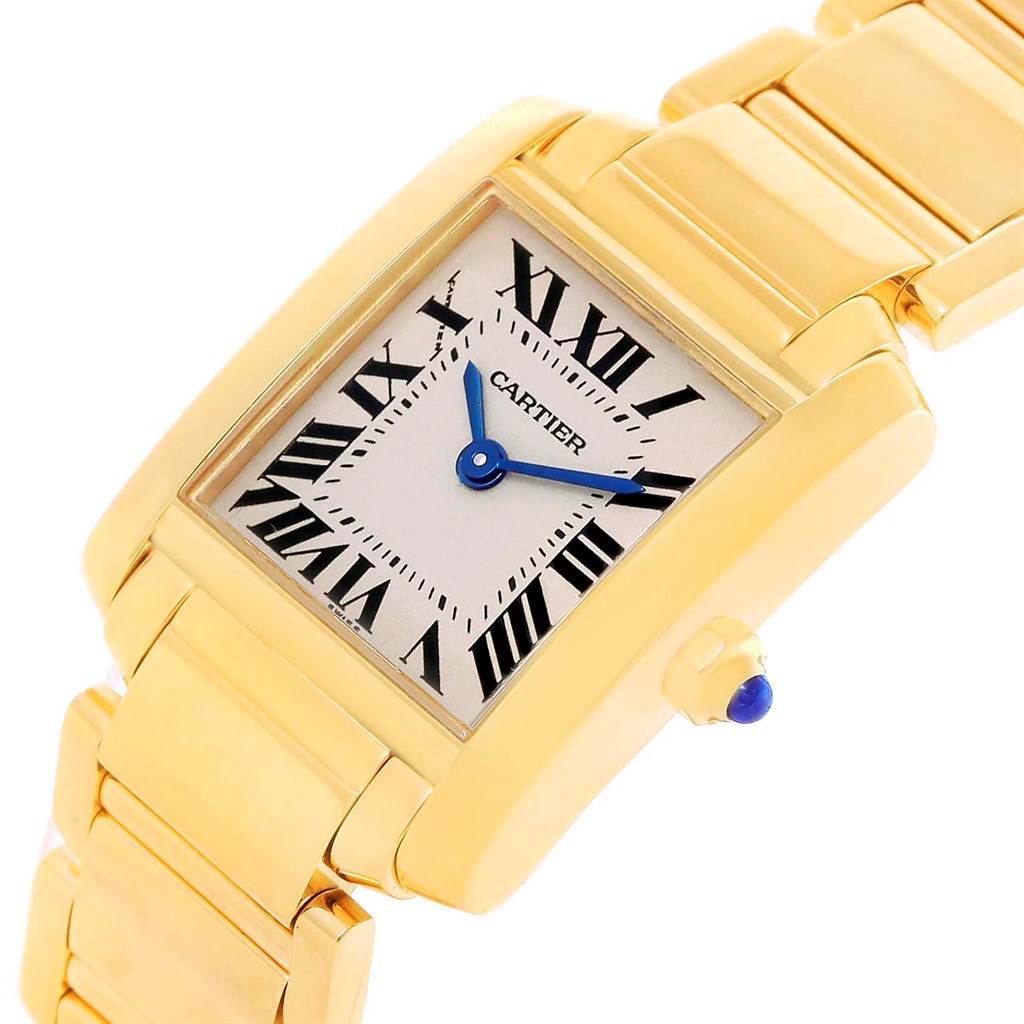 The image shows a close-up, angled view of a Cartier Tank Francaise W50002N2 Women's Yellow Gold Silver Dial W50002N2 Women's Yellow Gold Silver Dial watch, highlighting the face, crown, and part of the band.
