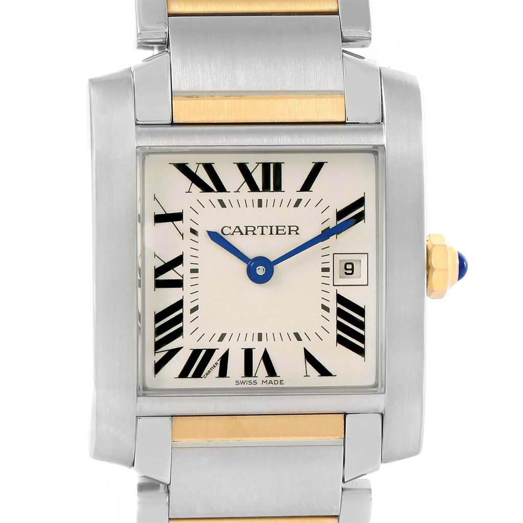 The image shows a close-up of the Cartier Tank Francaise W51012Q4 Women's Steel and Gold (two tone) Silver Dial W51012Q4 Women's Steel and Gold (two tone) Silver Dial watch face and parts of the bracelet, highlighting the Roman numeral dial and date window.