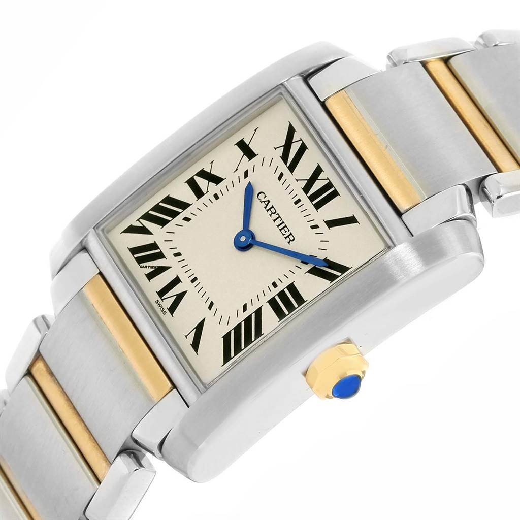 The image shows a close-up angled view of the Cartier Tank Francaise W2TA0003 Women's Steel and Gold (two tone) Silver Dial W2TA0003 Women's Steel and Gold (two tone) Silver Dial watch dial, crown, and bracelet.