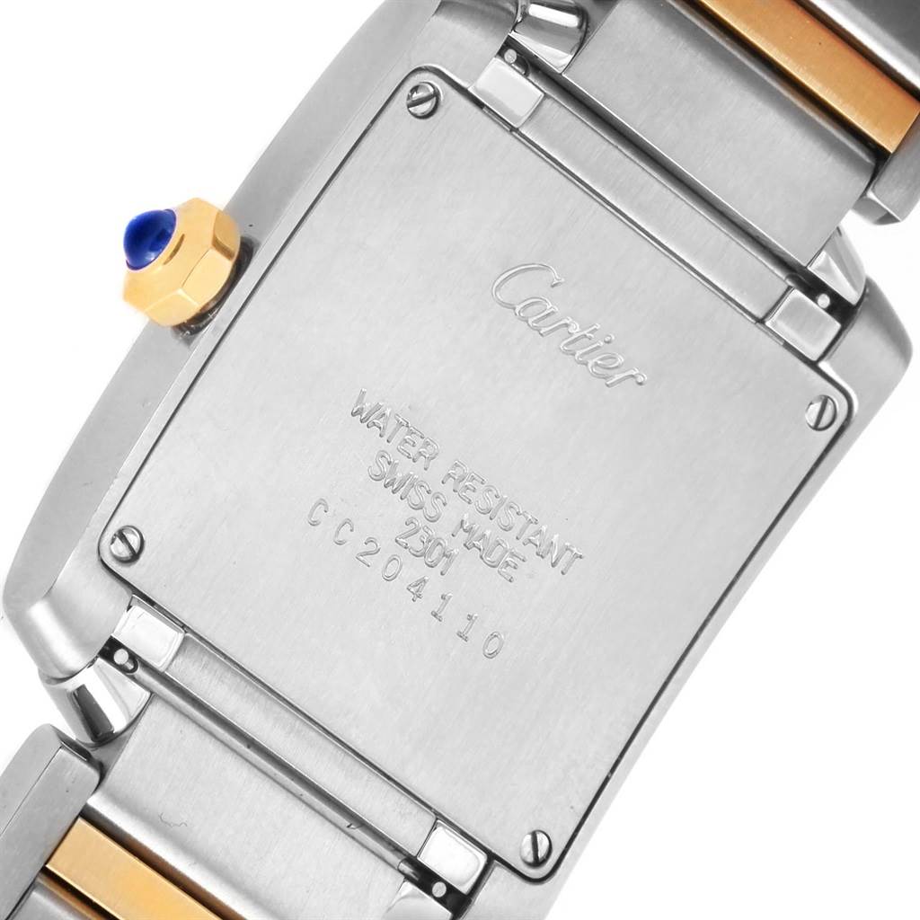 This image shows the back case of a Cartier Tank Francaise W2TA0003 Women's Steel and Gold (two tone) Silver Dial W2TA0003 Women's Steel and Gold (two tone) Silver Dial watch, displaying its water resistance and Swiss-made markings.
