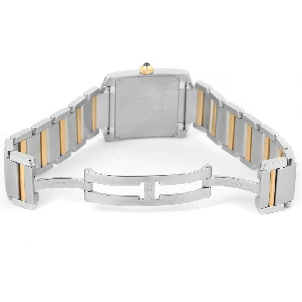 The image shows the back view of a Cartier Tank Francaise W2TA0003 Women's Steel and Gold (two tone) Silver Dial W2TA0003 Women's Steel and Gold (two tone) Silver Dial watch, highlighting its bracelet and clasp.