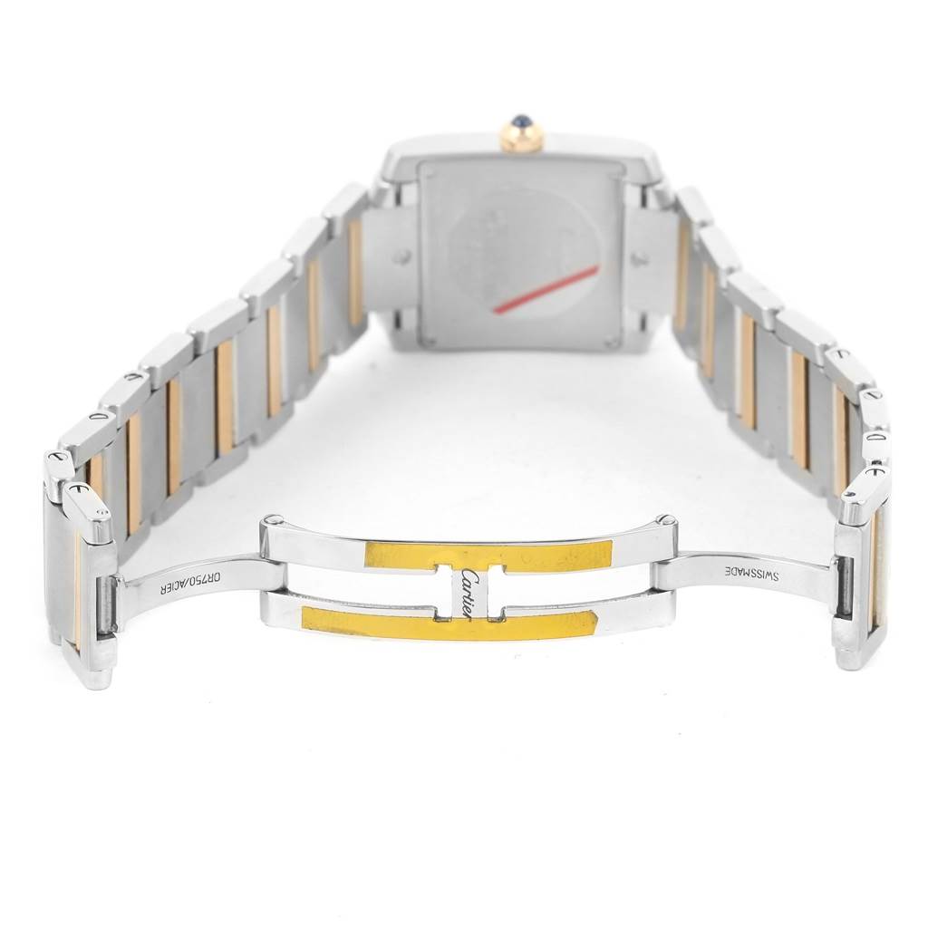 This image shows the underside of a Cartier Tank Francaise W51012Q4 Women's Steel and Gold (two tone) Silver Dial W51012Q4 Women's Steel and Gold (two tone) Silver Dial watch, highlighting its two-tone metal bracelet and deployment clasp.
