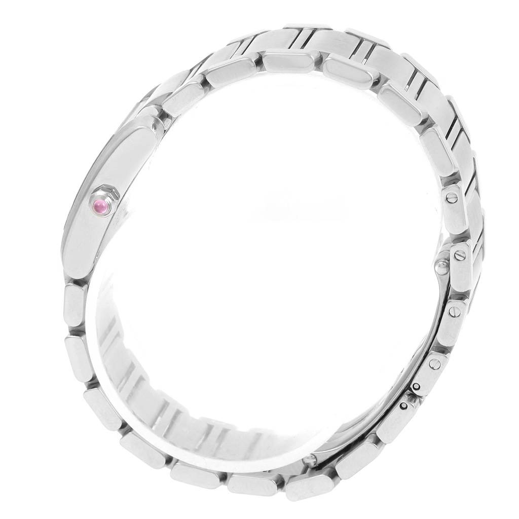 This image shows the side view of the Tank Française by Cartier, focusing on the metal bracelet and crown with a pink cabochon.