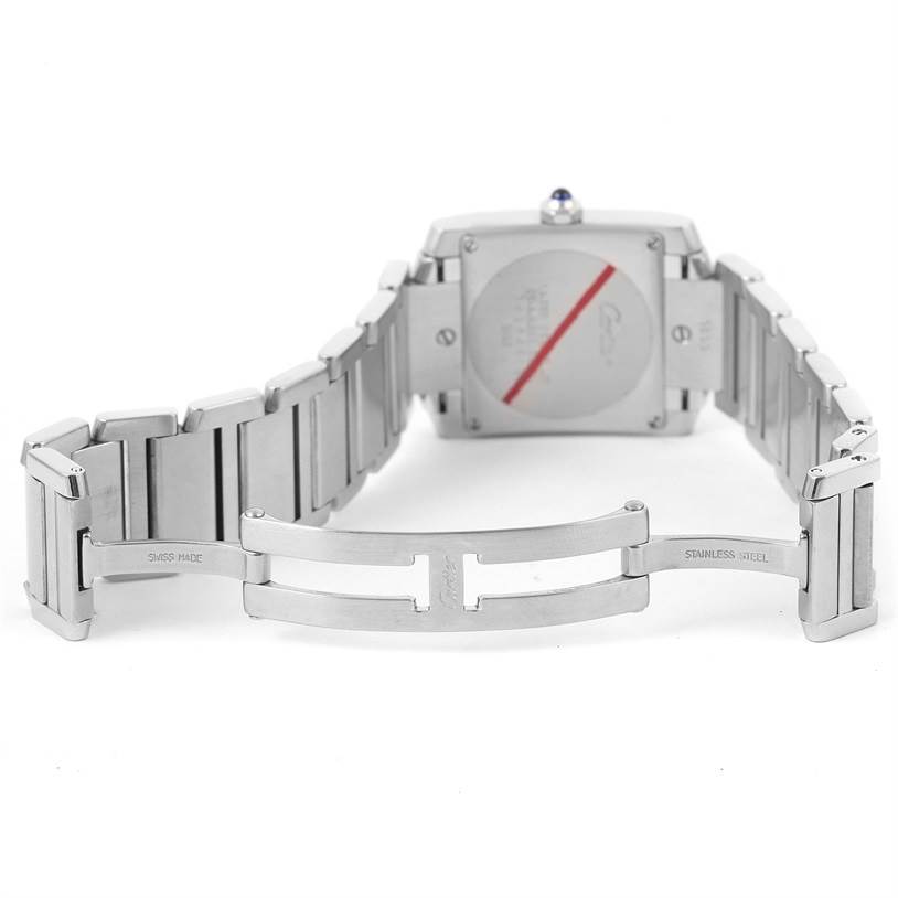 This image shows the back and clasp of a Cartier Tank Française watch, with the bracelet partially opened.