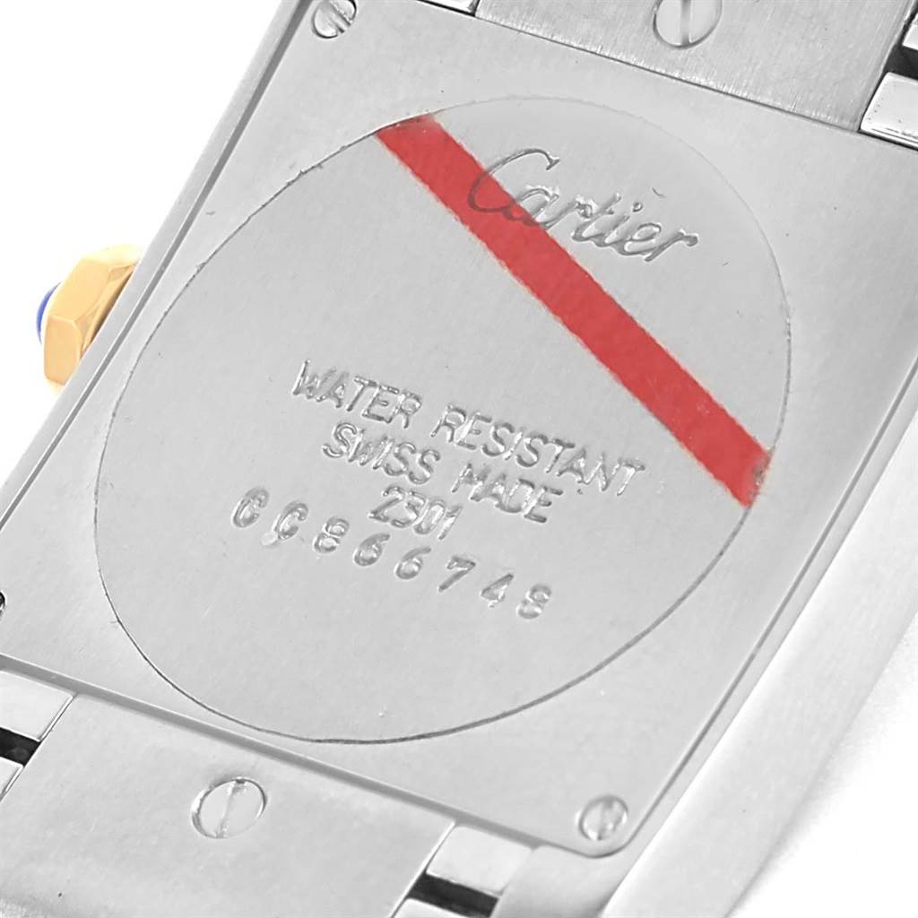 The image shows the back case of a Cartier Tank Francaise W2TA0003 Women's Steel and Gold (two tone) Silver Dial W2TA0003 Women's Steel and Gold (two tone) Silver Dial watch, highlighting the maker's mark and water resistance details.