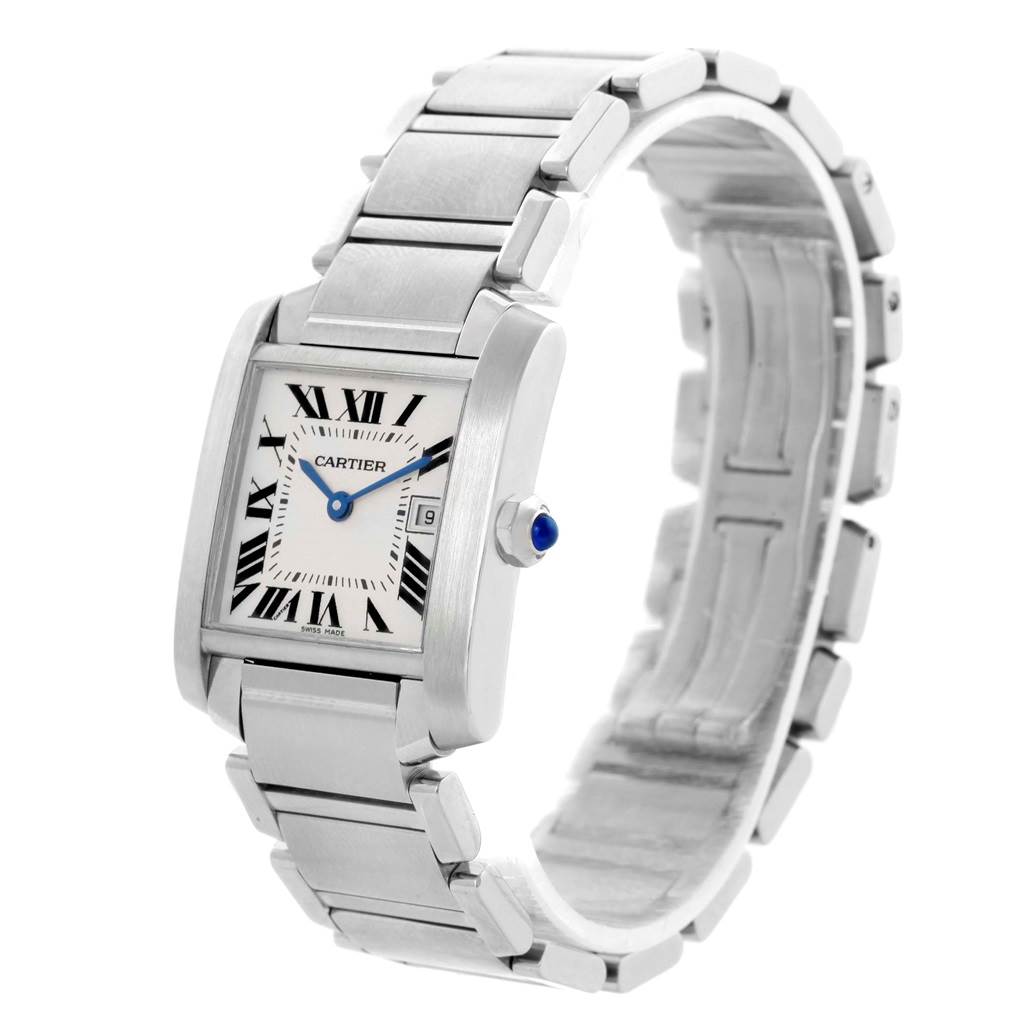 The Cartier Tank Française watch is shown at a right-side angle, displaying its face, bracelet, and the crown with a blue cabochon.