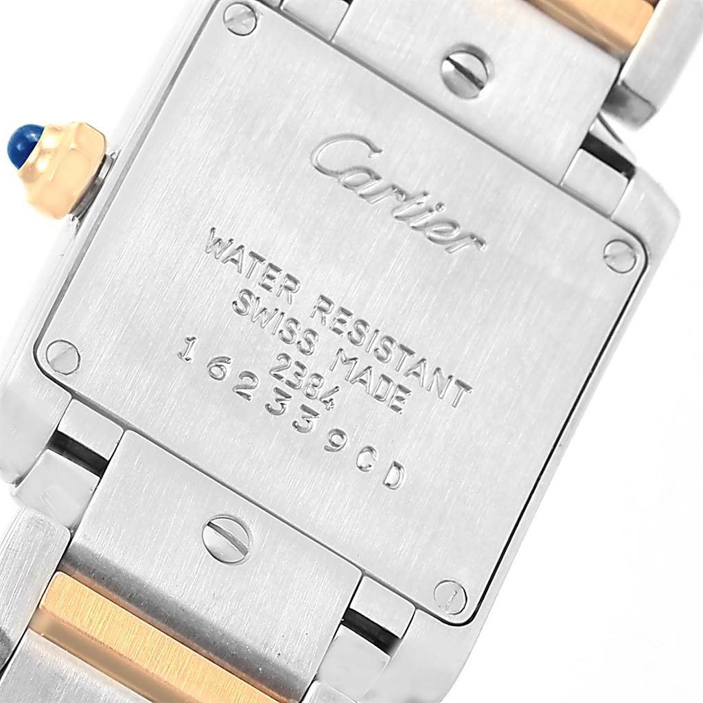 The image shows the back side and some links of the Cartier Tank Francaise W51007Q4 Women's Steel and Gold (two tone) Silver Dial W51007Q4 Women's Steel and Gold (two tone) Silver Dial watch, focusing on inscriptions and details.