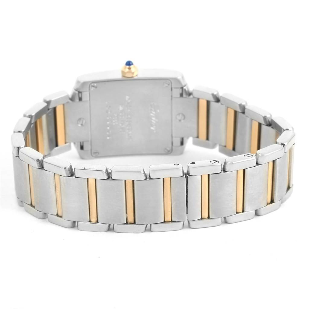 This image shows the back view of a Cartier Tank Française watch, featuring its two-tone metal bracelet and the watch's case back.
