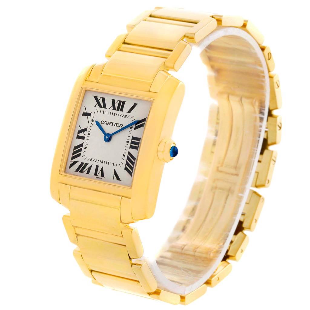 This image shows a Tank Francaise model by Cartier at a three-quarter view, highlighting the gold bracelet, dial, and sapphire crown.